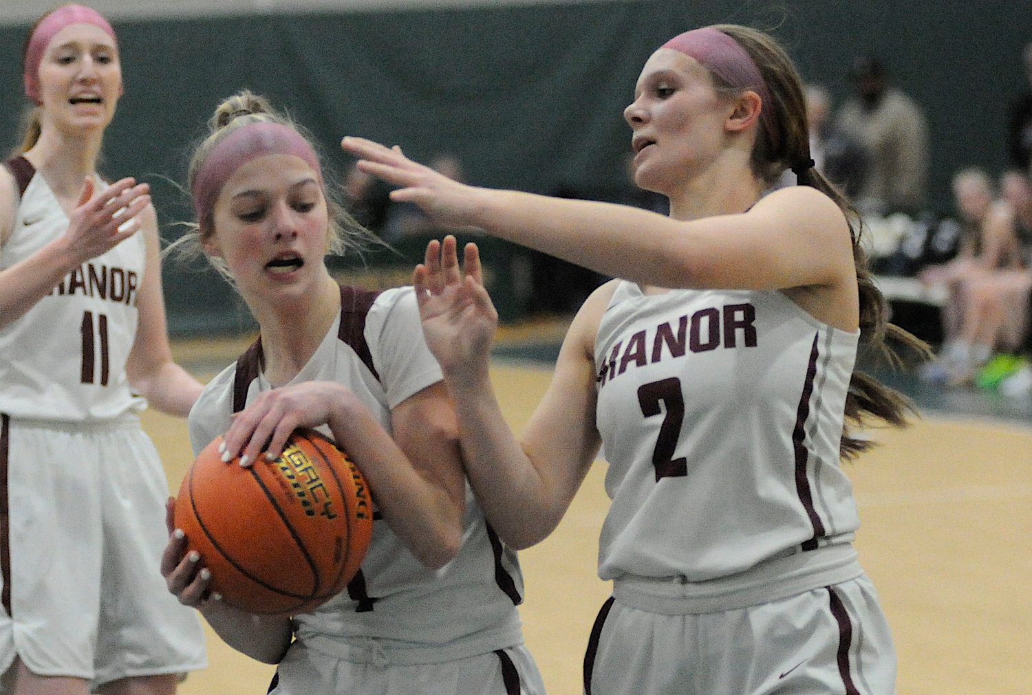 Double rebounders. Manor’s Alyssa Peck and Mackenzie Carlson both go for a rebound. Carlson scored 11 points.